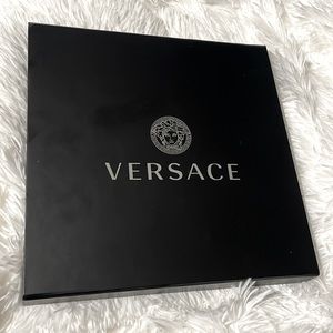 Black Versace scarf box with white Medusa head logo tissue paper